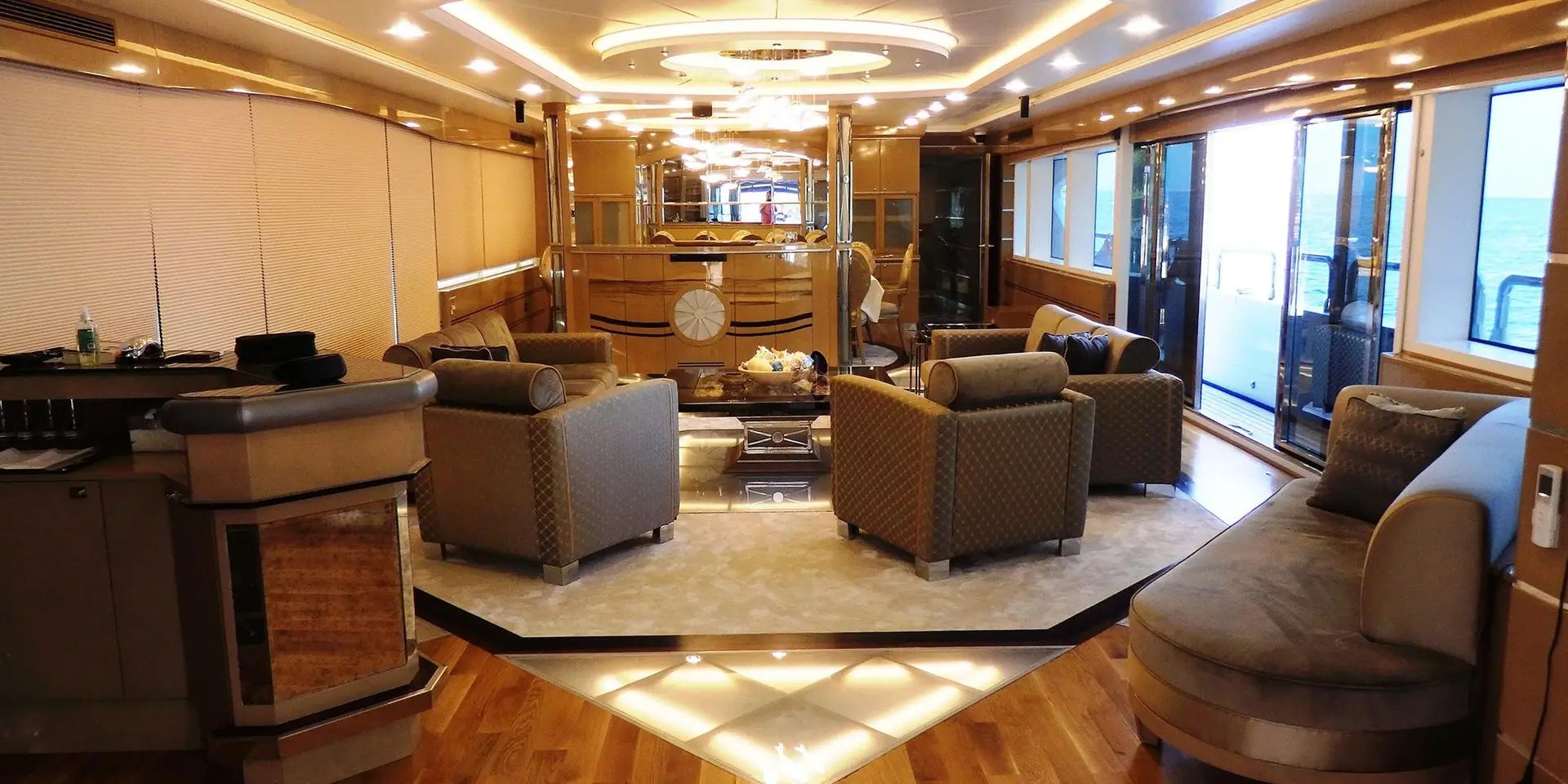 Wide view of the main salon of M/Y DESTINY looking aft toward the exterior